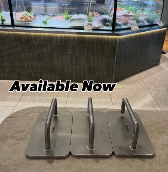 The Fishizzel cooking fish in a pan